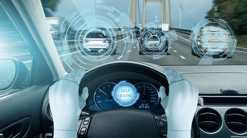 abstract image of self-driving with robotic hands on a steering wheel and IoT graphics augmented reality view of the traffic out the front window