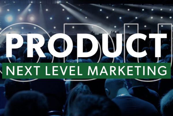 View of conference main stage from audience with the words Next Level Product Marketing in foreground