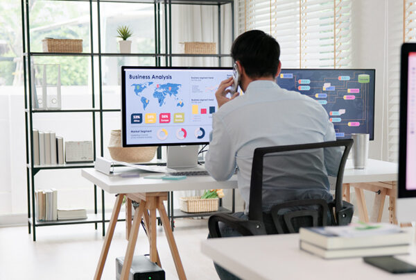 product marketing manager at desk reviewing business analytics