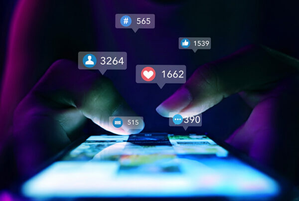 marketing leader viewing likes on social media app on smartphone