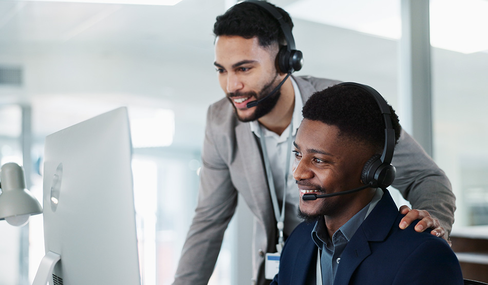 two sales development representative with headsets cold calling prospects to book leads